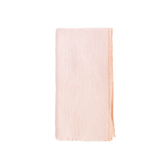 Folded blush and white zigzag napkin