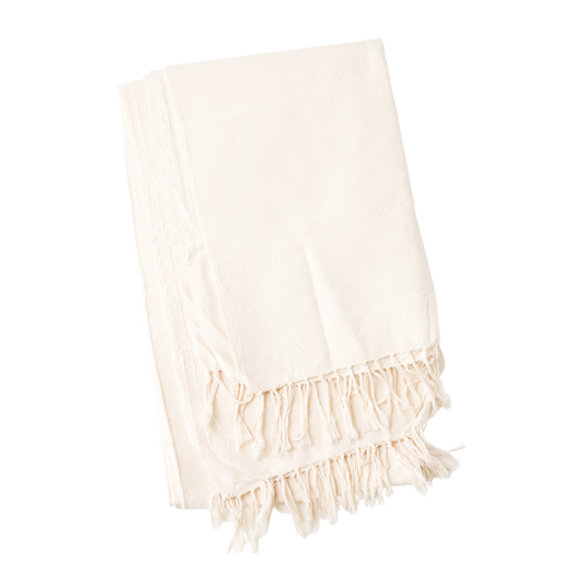 Folded cream tablecloth