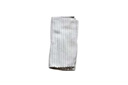 Folded greige and white patterned napkin