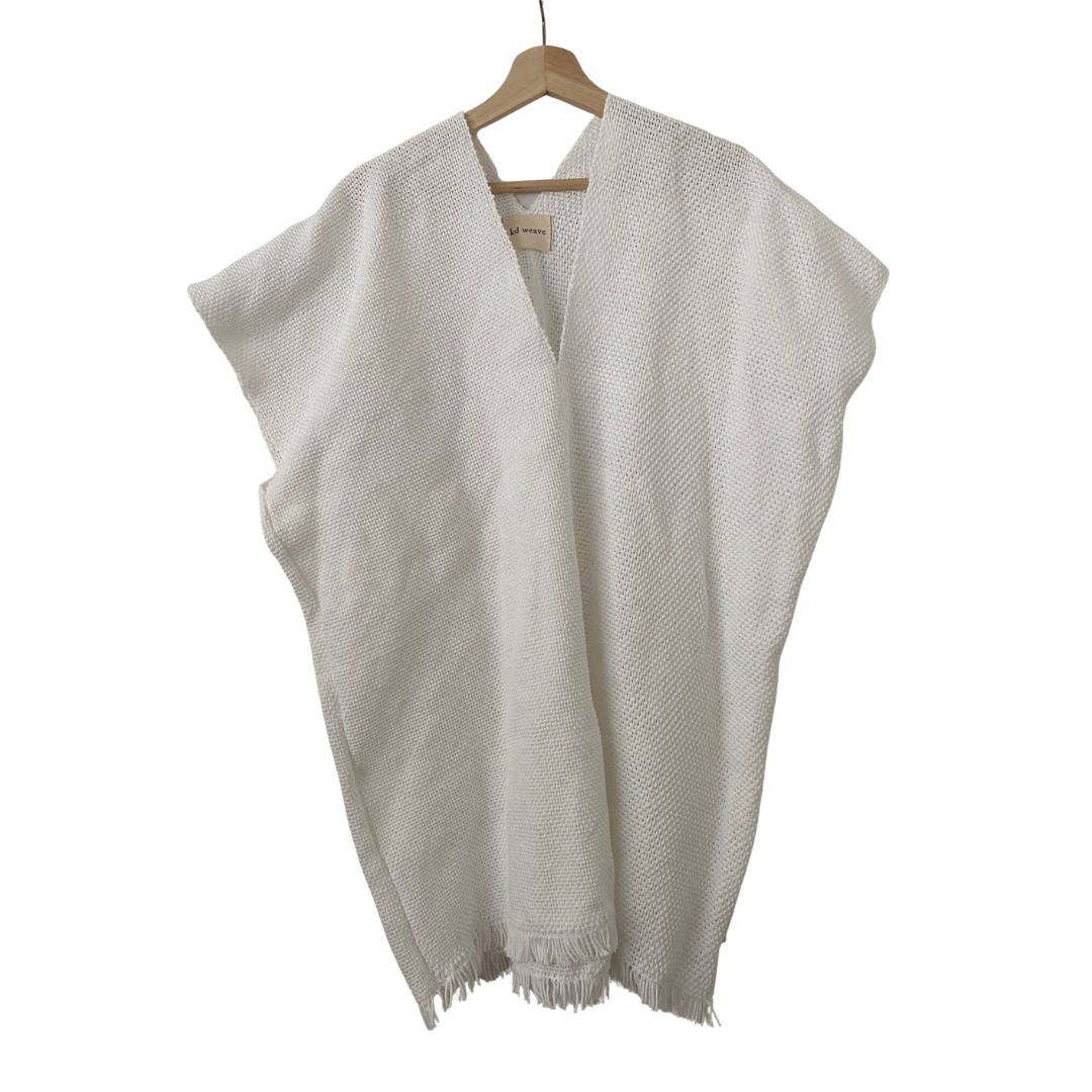 White caftan on wooden hanger