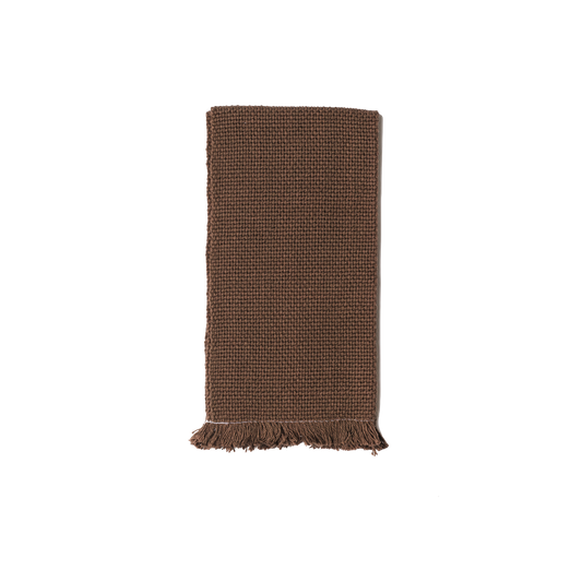 Folded chocolate brown hand towel