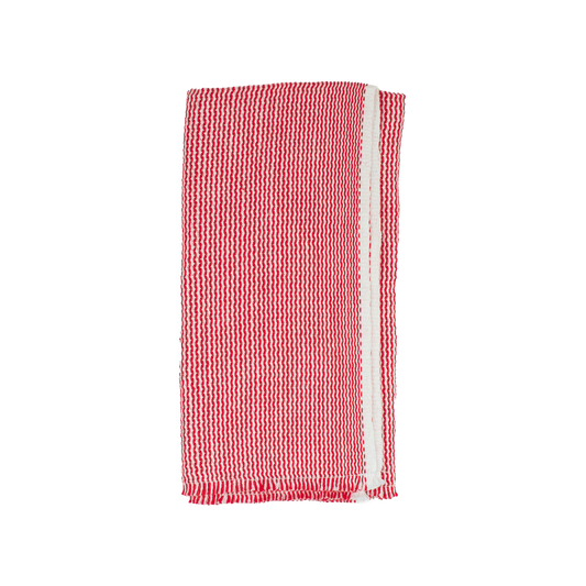 Folded red and white zigzag napkin