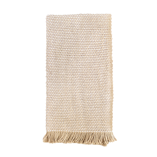 Folded tan and white hand towel