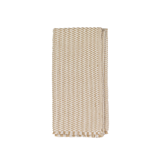 Folded tan and white patterned napkin