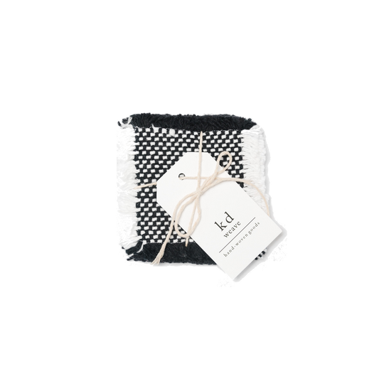 White and black coasters wrapped in twine