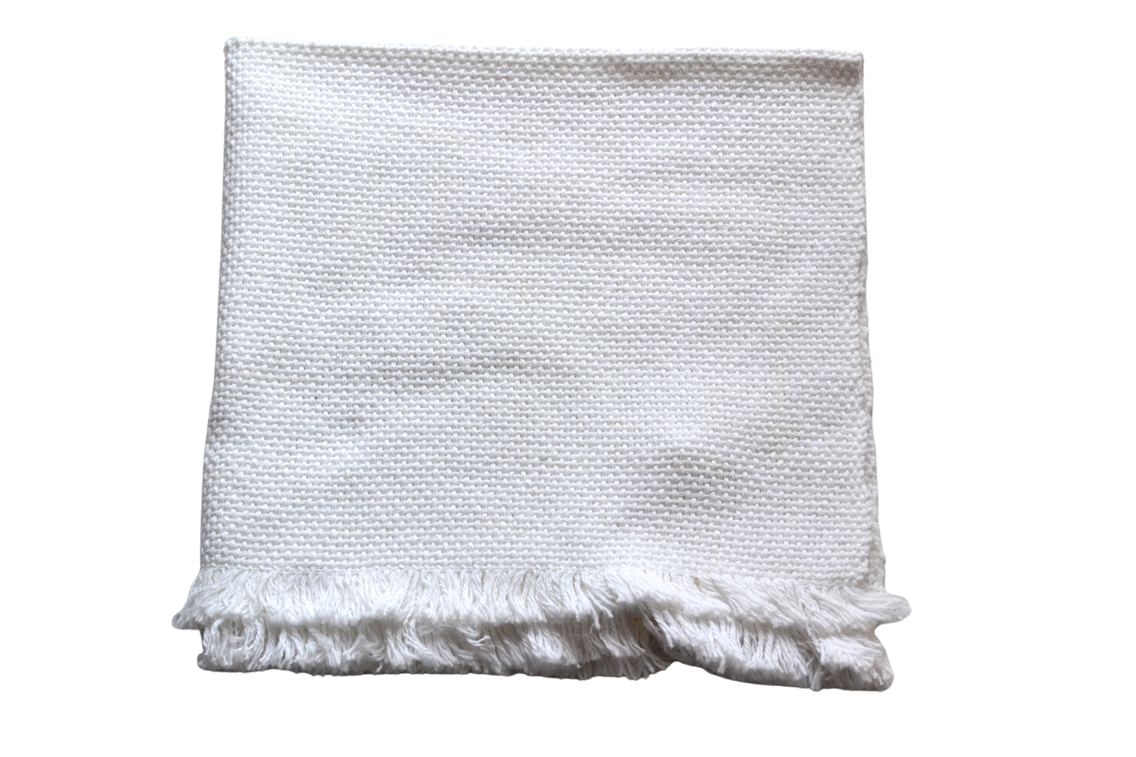 Folded white small baby blanket