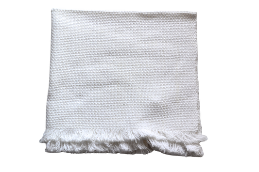 Folded white small baby blanket