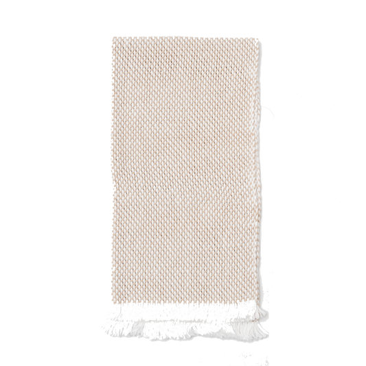 Folded white and tan hand towel
